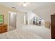 Spacious bedroom featuring vaulted ceilings, dormer windows, and neutral decor at 1405 Arden Trace Ln, Lawrenceville, GA 30043