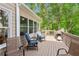 Outdoor deck with patio furniture and a grill, perfect for outdoor entertaining and enjoying the view at 1405 Arden Trace Ln, Lawrenceville, GA 30043