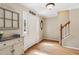 Welcoming entryway with hardwood floors, a staircase, and a vintage cabinet at 1405 Arden Trace Ln, Lawrenceville, GA 30043