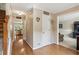 Inviting hallway featuring hardwood floors and neutral paint, leading to living areas at 1405 Arden Trace Ln, Lawrenceville, GA 30043