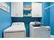 Bright laundry room featuring new washer and dryer, white cabinetry, and blue painted walls at 1405 Arden Trace Ln, Lawrenceville, GA 30043