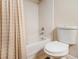 Bathroom with shower/tub combination with shower curtain and nearby toilet at 2657 Lenox Ne Rd # C38, Atlanta, GA 30324