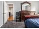 Bedroom with grey carpet, a large dresser with mirror, and a view into the hall at 2657 Lenox Ne Rd # C38, Atlanta, GA 30324