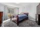 Spacious bedroom with a large window providing natural light, nice carpet, and stylish furnishings at 2657 Lenox Ne Rd # C38, Atlanta, GA 30324