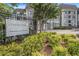 Lenox Green Condominium community sign with manicured bushes and a black metal fence at 2657 Lenox Ne Rd # C38, Atlanta, GA 30324