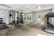 Community gym with mirrors, weightlifting equipment, and an exit to the outdoors at 2657 Lenox Ne Rd # C38, Atlanta, GA 30324