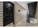 Condo front door and hallway leading to stairs at 2657 Lenox Ne Rd # C38, Atlanta, GA 30324