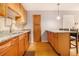 This cozy kitchen features granite countertops, wood cabinets, and stainless steel appliances at 2657 Lenox Ne Rd # C38, Atlanta, GA 30324