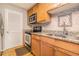 Charming kitchen with stone backsplash, stainless steel appliances, and wooden cabinets at 2657 Lenox Ne Rd # C38, Atlanta, GA 30324