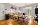 Cozy living room with hardwood floors, area rug, and furniture at 2657 Lenox Ne Rd # C38, Atlanta, GA 30324