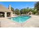 Community pool featuring clear blue water, an open-air cabana, and comfortable lounge chairs for relaxing poolside at 2657 Lenox Ne Rd # C38, Atlanta, GA 30324