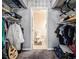 Spacious walk-in closet with shelves and a bathroom with toilet visible at the end at 2657 Lenox Ne Rd # C38, Atlanta, GA 30324