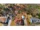 Property featuring a neatly maintained yard, mature trees, and ample parking space, as seen from above at 3850 Pilgrim Mill Rd, Cumming, GA 30041
