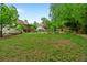 Expansive backyard featuring lush greenery, mature trees, and a rock border, creating a serene outdoor space at 3850 Pilgrim Mill Rd, Cumming, GA 30041