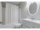 Clean bathroom featuring a shower-tub combo, sleek vanity, and neutral colors at 3850 Pilgrim Mill Rd, Cumming, GA 30041