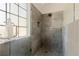 Contemporary shower features gray tile, glass door, and a decorative nautical accent on the frosted window at 3850 Pilgrim Mill Rd, Cumming, GA 30041