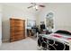 Bedroom with vaulted ceilings, window, bed, desk, and a tall wooden dresser at 3850 Pilgrim Mill Rd, Cumming, GA 30041