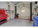 Spacious garage with car lift and ample storage space, perfect for automotive enthusiasts and hobbyists at 3850 Pilgrim Mill Rd, Cumming, GA 30041
