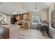 Bright kitchen with a large window, breakfast bar seating, and modern stainless steel appliances at 3850 Pilgrim Mill Rd, Cumming, GA 30041
