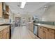 Modern kitchen featuring stainless steel appliances, custom wood cabinets, and a spacious island at 3850 Pilgrim Mill Rd, Cumming, GA 30041