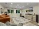 Spacious living room features recessed lighting, large windows, and a decorative area rug at 3850 Pilgrim Mill Rd, Cumming, GA 30041
