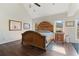 Vaulted ceiling, and hardwood floors are enhanced by natural light from the room's many windows at 3850 Pilgrim Mill Rd, Cumming, GA 30041