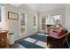 Bright sitting area with natural light, hardwood floors, and views of backyard landscaping at 3850 Pilgrim Mill Rd, Cumming, GA 30041