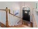 Staircase with hardwood floors and a view of the front door at 3850 Pilgrim Mill Rd, Cumming, GA 30041
