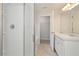 Bathroom with a double sink vanity, stand up shower, and a door to the walk-in closet at 500 Charleston Pl, Villa Rica, GA 30180