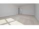 Spacious carpeted bedroom filled with natural light and neutral paint at 500 Charleston Pl, Villa Rica, GA 30180