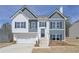 Charming two-story home with white and gray siding and black window shutters at 500 Charleston Pl, Villa Rica, GA 30180