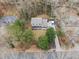 An aerial view showcases the home's well-maintained yard and proximity to mature trees and surrounding neighborhood at 650 Hunterhill Ct, Roswell, GA 30075