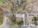 An aerial view captures the home with a well-manicured lawn, trees, and driveway at 650 Hunterhill Ct, Roswell, GA 30075