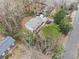 An aerial view showcases a well-maintained home with mature trees and landscaping at 650 Hunterhill Ct, Roswell, GA 30075