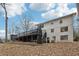 Backyard view with a two story deck and large picture windows at 650 Hunterhill Ct, Roswell, GA 30075