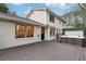 The backyard shows a hot tub on the deck and exterior brick elevation of the home at 650 Hunterhill Ct, Roswell, GA 30075
