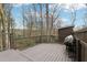 An expansive wooden deck with a grill is perfect for outdoor entertaining at 650 Hunterhill Ct, Roswell, GA 30075