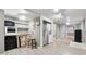 Basement area with kitchenette, sink, and stainless steel refrigerator at 650 Hunterhill Ct, Roswell, GA 30075