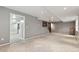 A spacious finished basement with neutral walls and carpet, offering versatile living space at 650 Hunterhill Ct, Roswell, GA 30075