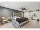 Spacious bedroom featuring a grey accent wall and an ensuite bathroom at 650 Hunterhill Ct, Roswell, GA 30075