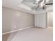 A carpeted bedroom boasts a ceiling fan and closet space, offering a comfortable and private retreat at 650 Hunterhill Ct, Roswell, GA 30075