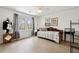 Cozy bedroom with hardwood floors, filled with natural light from large windows at 650 Hunterhill Ct, Roswell, GA 30075