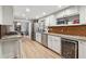 Bright kitchen with stainless steel appliances, granite countertops, and ample cabinet space for organized storage at 650 Hunterhill Ct, Roswell, GA 30075