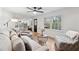 Bright and airy living room featuring hardwood floors, modern furnishings and view of kitchen area at 650 Hunterhill Ct, Roswell, GA 30075