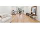 Bright living room with hardwood floors leading to a dining area at 650 Hunterhill Ct, Roswell, GA 30075