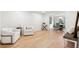 Bright living room with hardwood floors leading to a dining area at 650 Hunterhill Ct, Roswell, GA 30075
