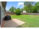 Level backyard with a concrete patio area perfect for grilling and outdoor dining at 1923 Hamby Place Nw Dr, Acworth, GA 30102