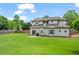 Spacious backyard with well-maintained lawn and privacy fencing provides a serene outdoor space at 1923 Hamby Place Nw Dr, Acworth, GA 30102