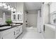 Bathroom featuring dual sinks and a shower-tub combo at 1923 Hamby Place Nw Dr, Acworth, GA 30102
