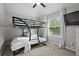 Comfortable bedroom featuring a bunkbed and a large window at 1923 Hamby Place Nw Dr, Acworth, GA 30102